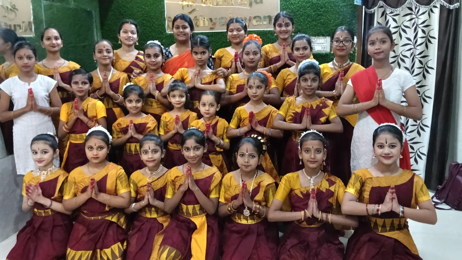 Dance students and adults gathered together at the academy