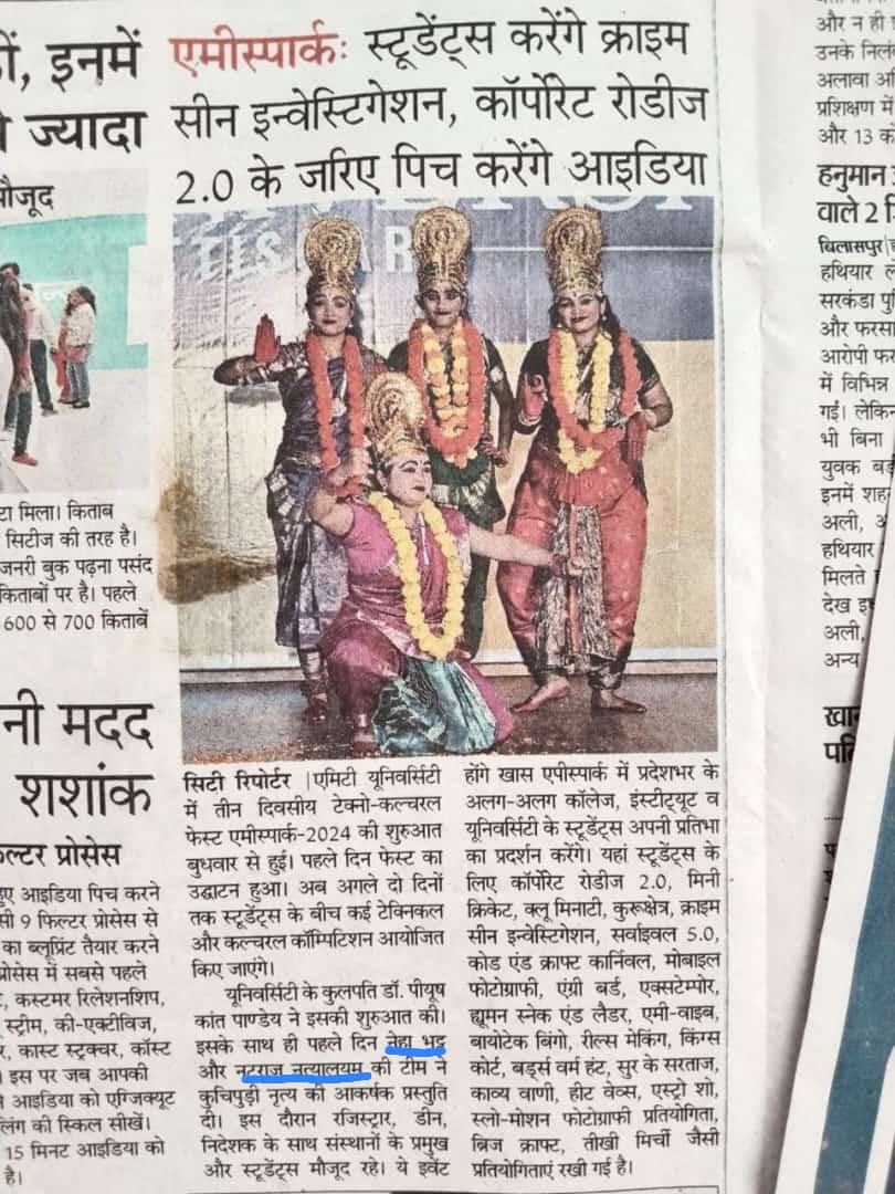 Hindi newspaper report with a photograph of dancers wearing garlands