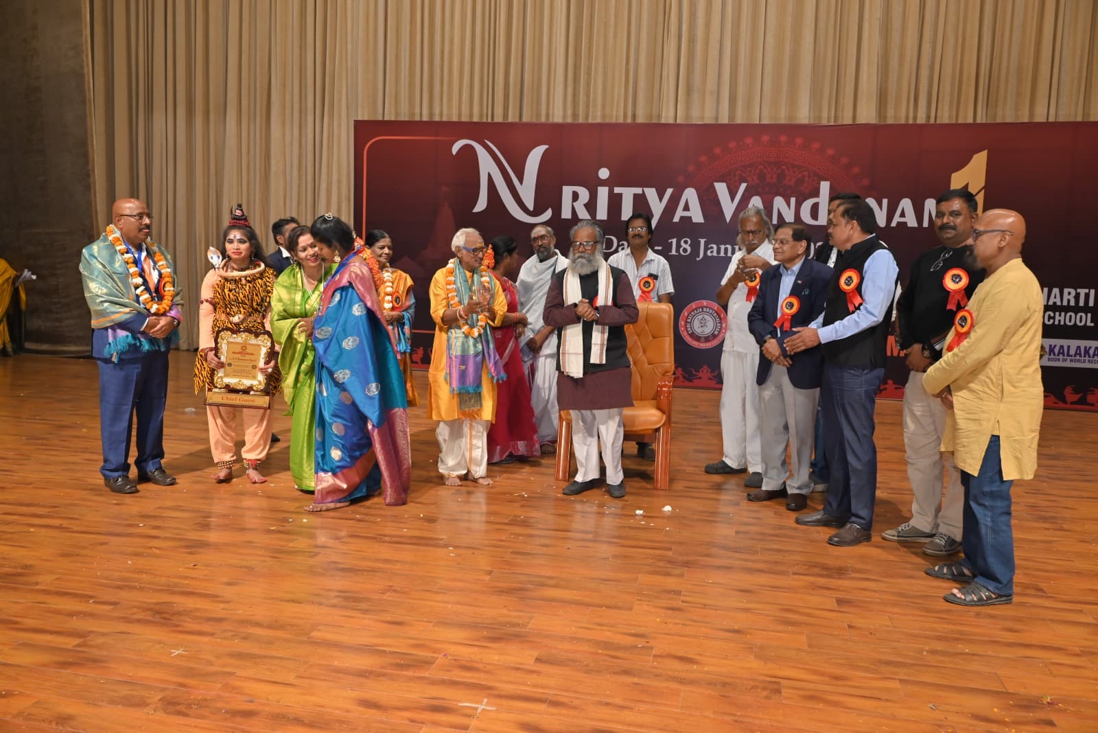 A group applauding a presentation at Nritya Vandanam